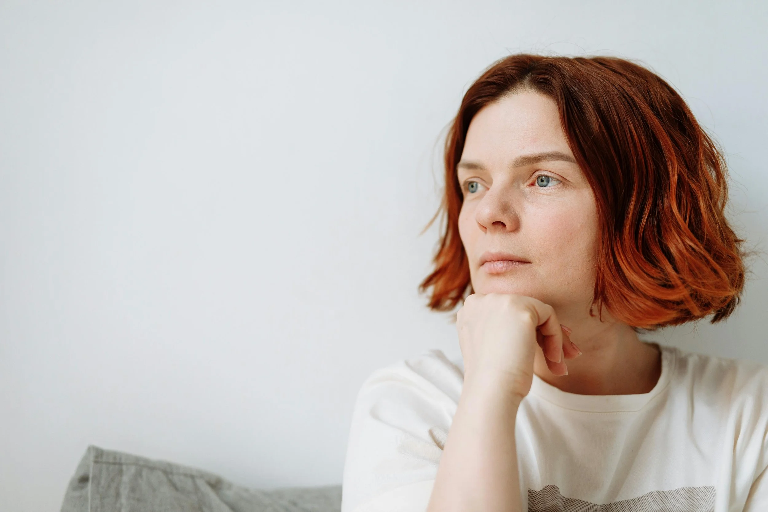 Adult reflecting quietly while managing intrusive thoughts and improving mental health wellness with OCD counseling in Arizona