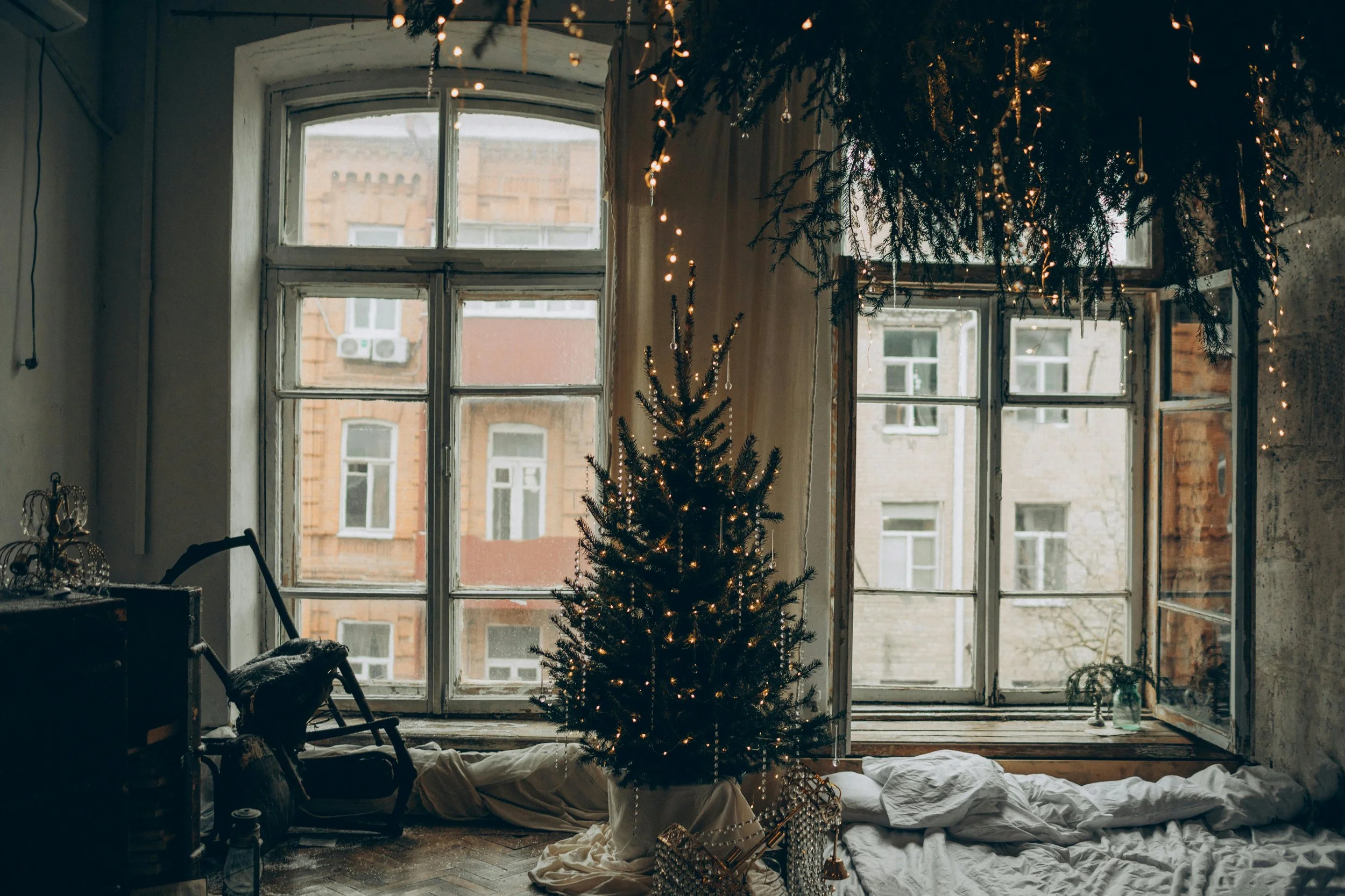 Window with gentle holiday décor and natural light, symbolizing a quiet holiday moment