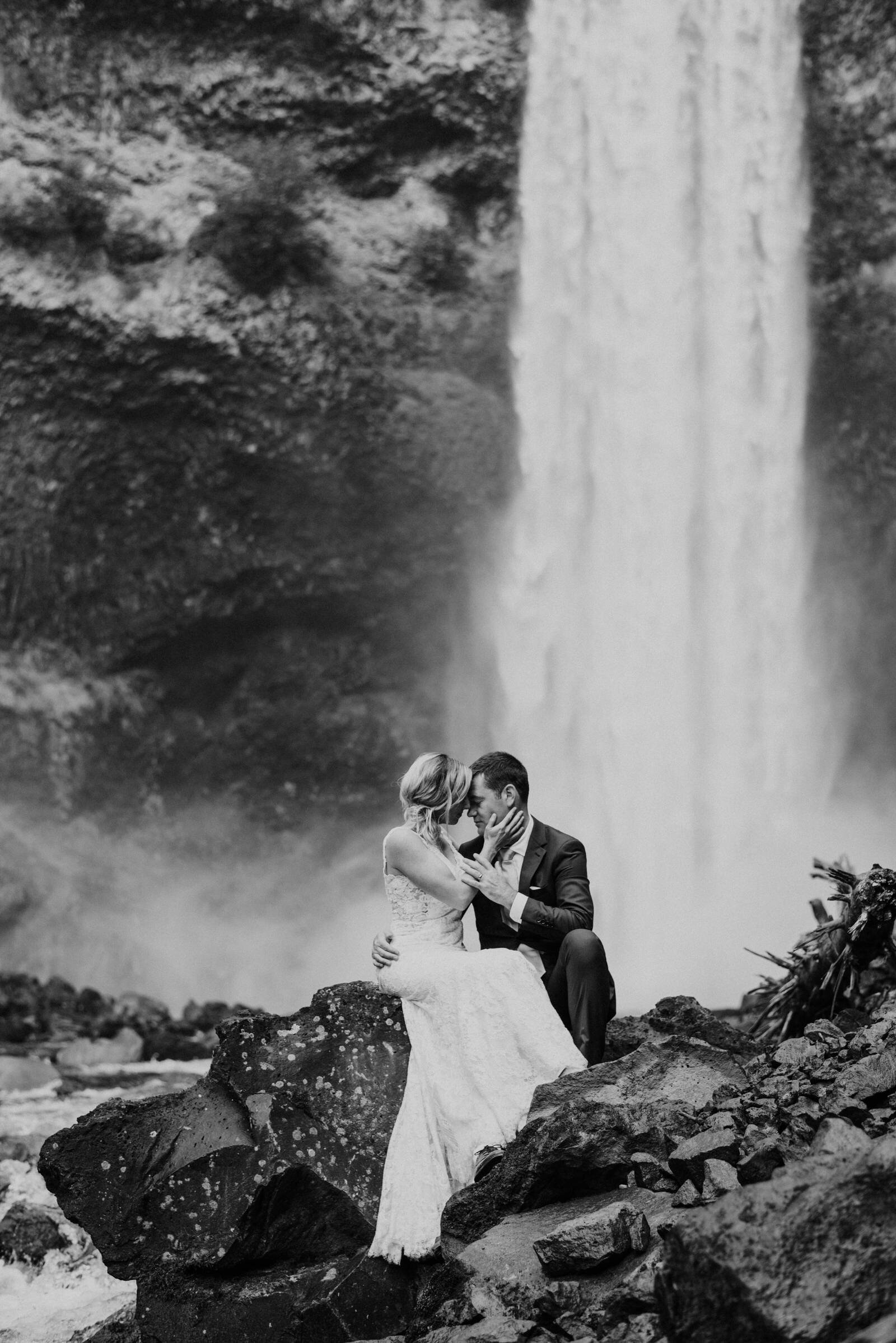 bride and groom kissing during post wedding adventure session