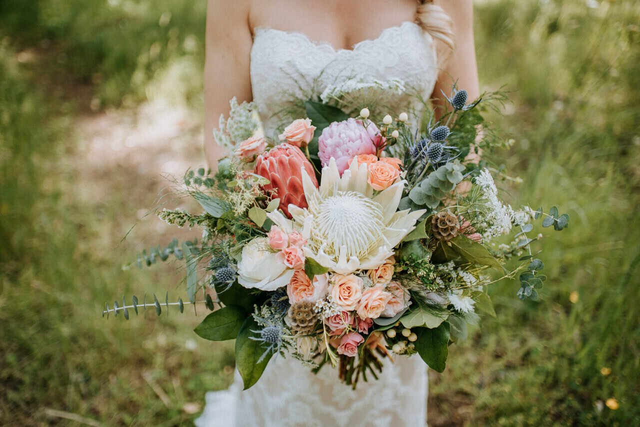 bridal floral wildflower bouquet held by bride at bodega ridge