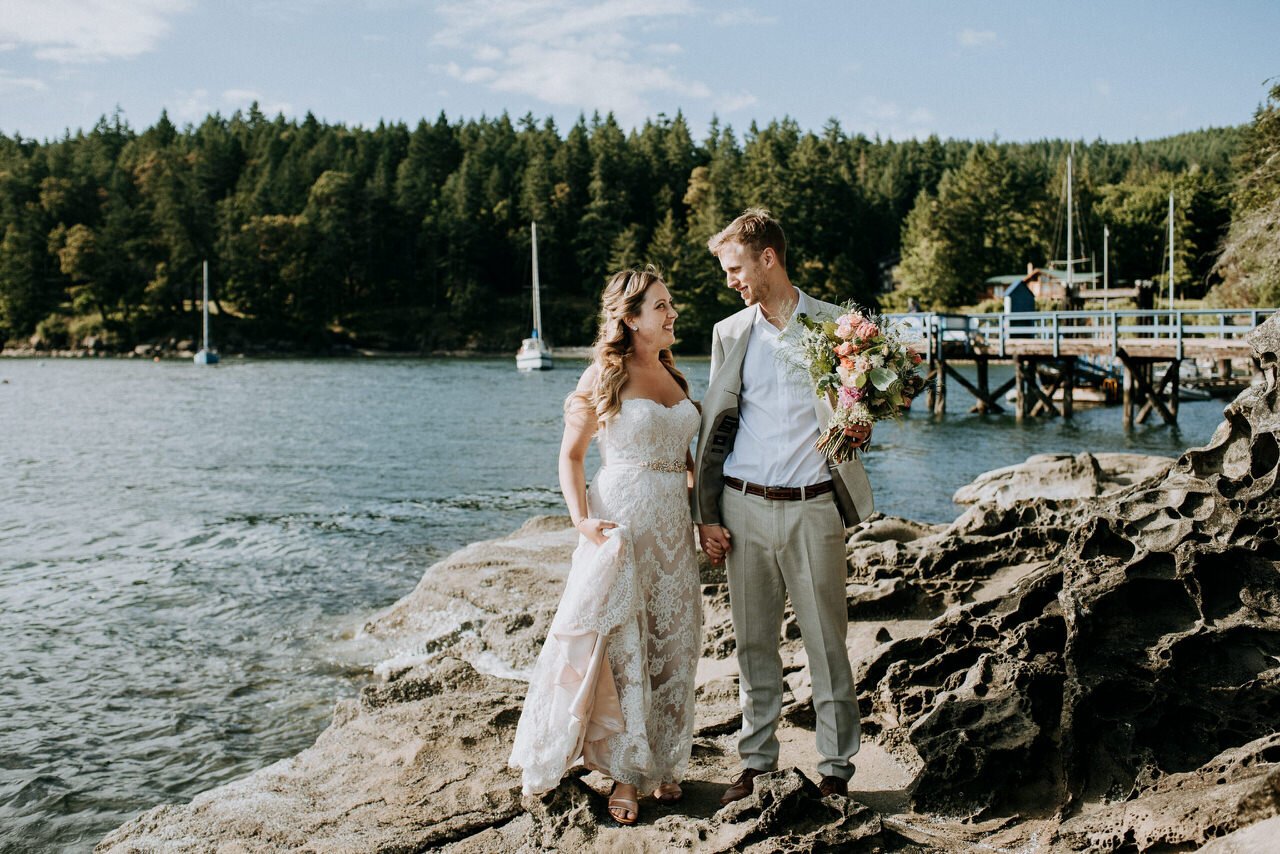 bride and groom near ocean at retreat cove galiano island