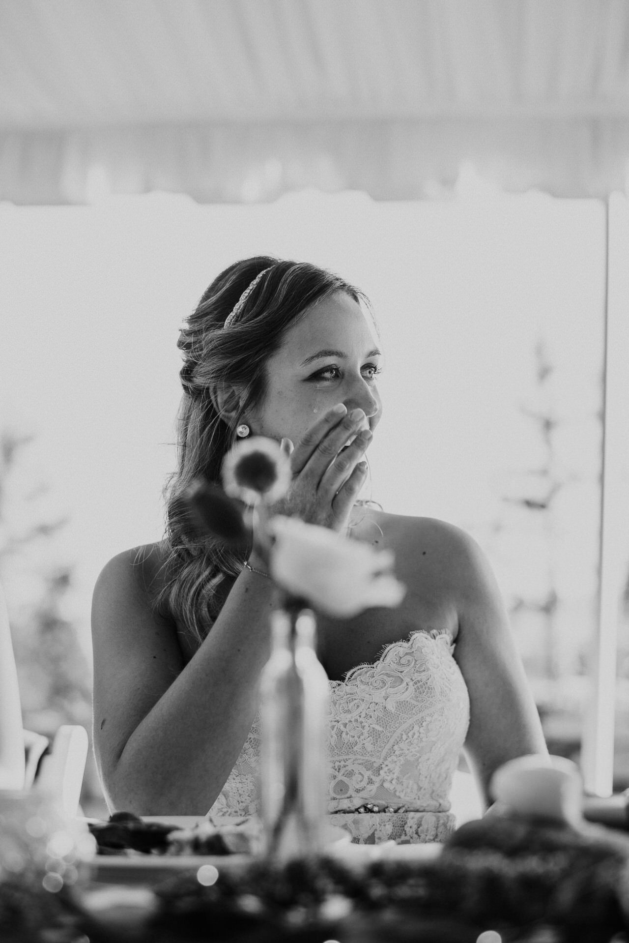 bride crying during emotional speech at wedding reception