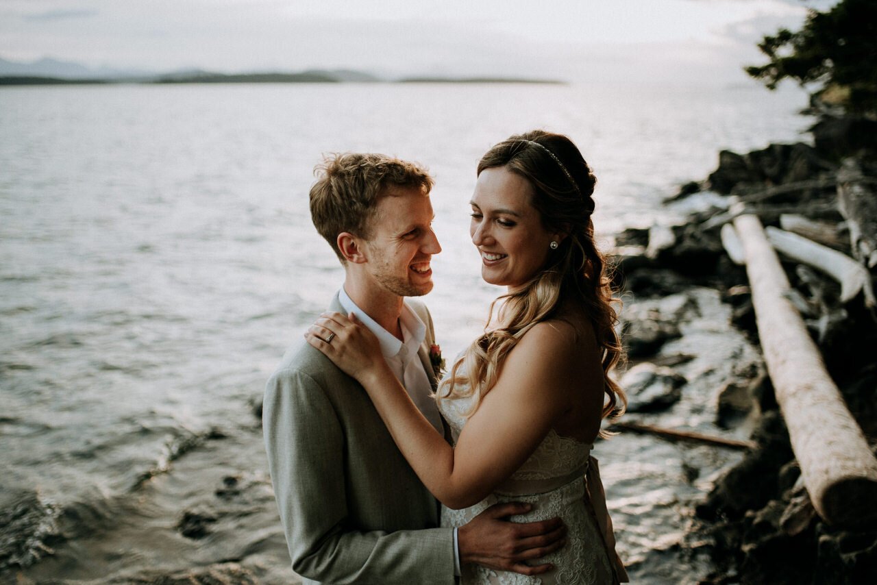 wedding couple portrait at sunset on rock beach galiano island