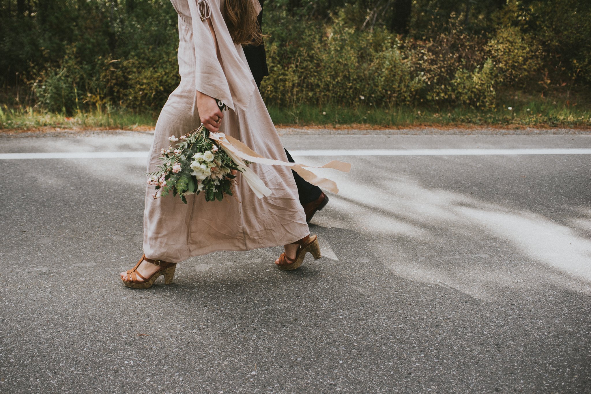 elopement bride walking bouquet candid kananaskis