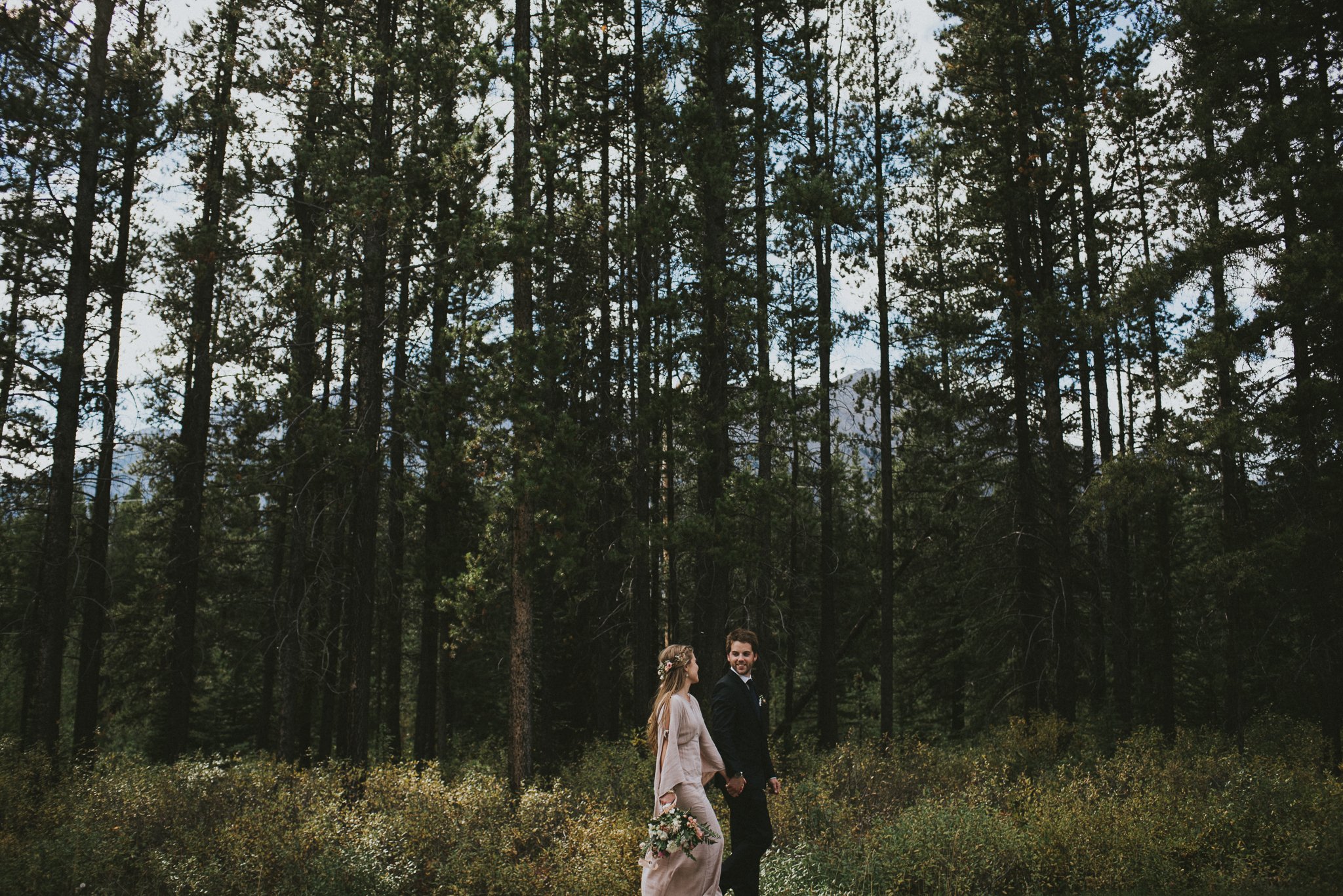 bride groom walk forest kananaskis elopement
