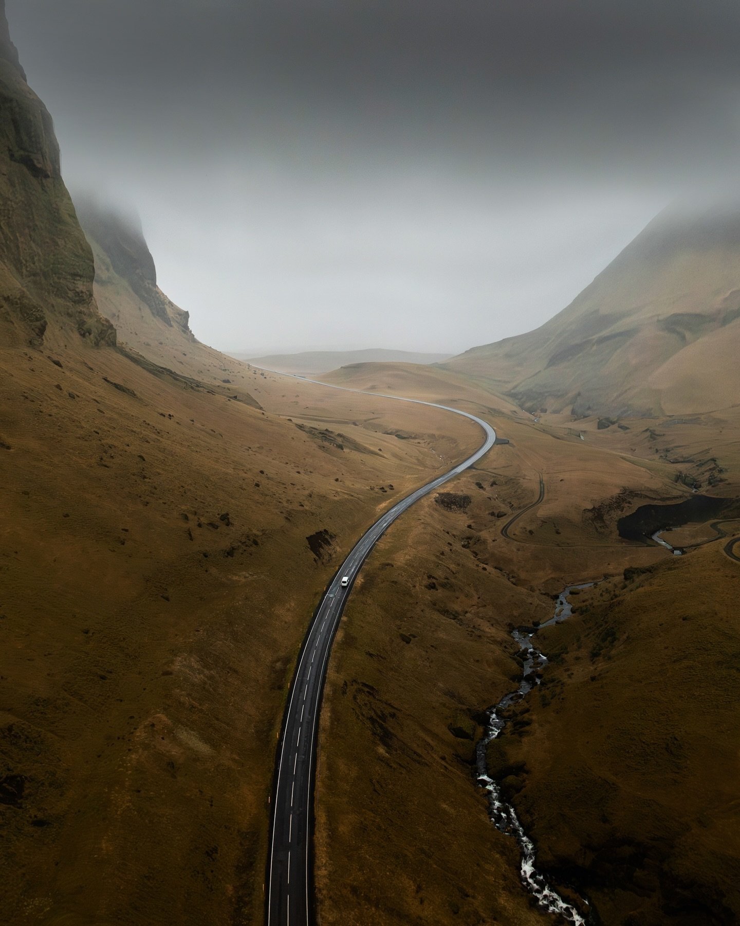 Road to infinity.

I love cloudy and overcast days and I'd take them over sunny days any time for photography. Especially if you're driving by the mountains, it makes the entire scene look dramatic!

The shot was taken while it was drizzling but I kn