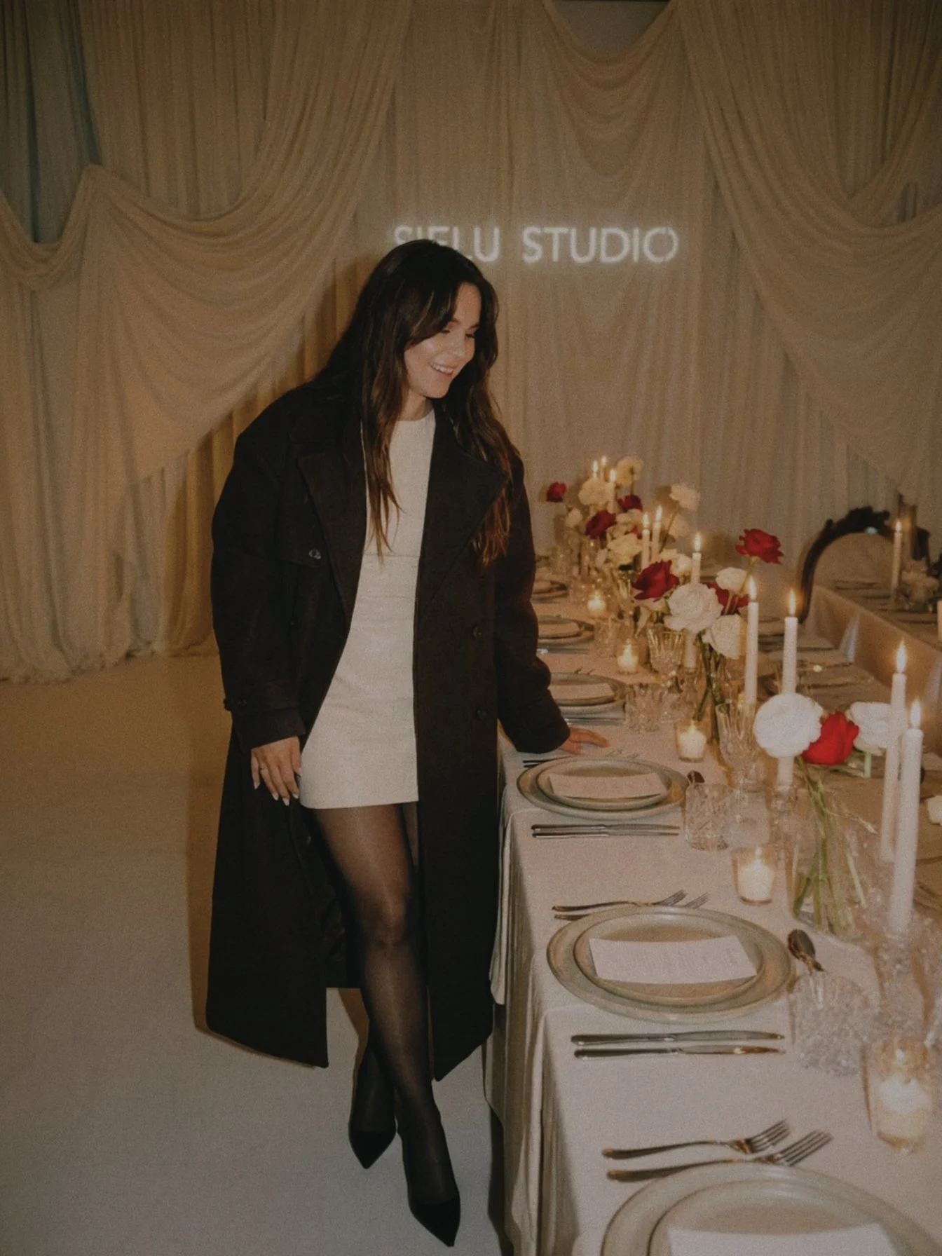 Emily Logan, Creative Director of Sielu Studio, at a styled dinner event showcasing creative direction, brand storytelling, and production design.