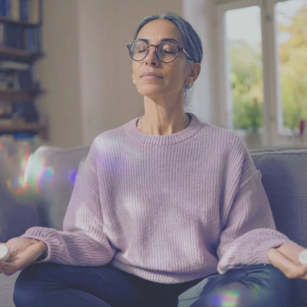 woman in purple sweater meditating