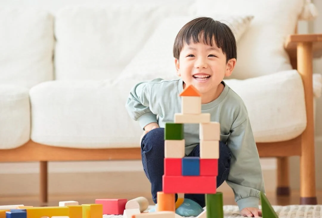 child playing with building blocks