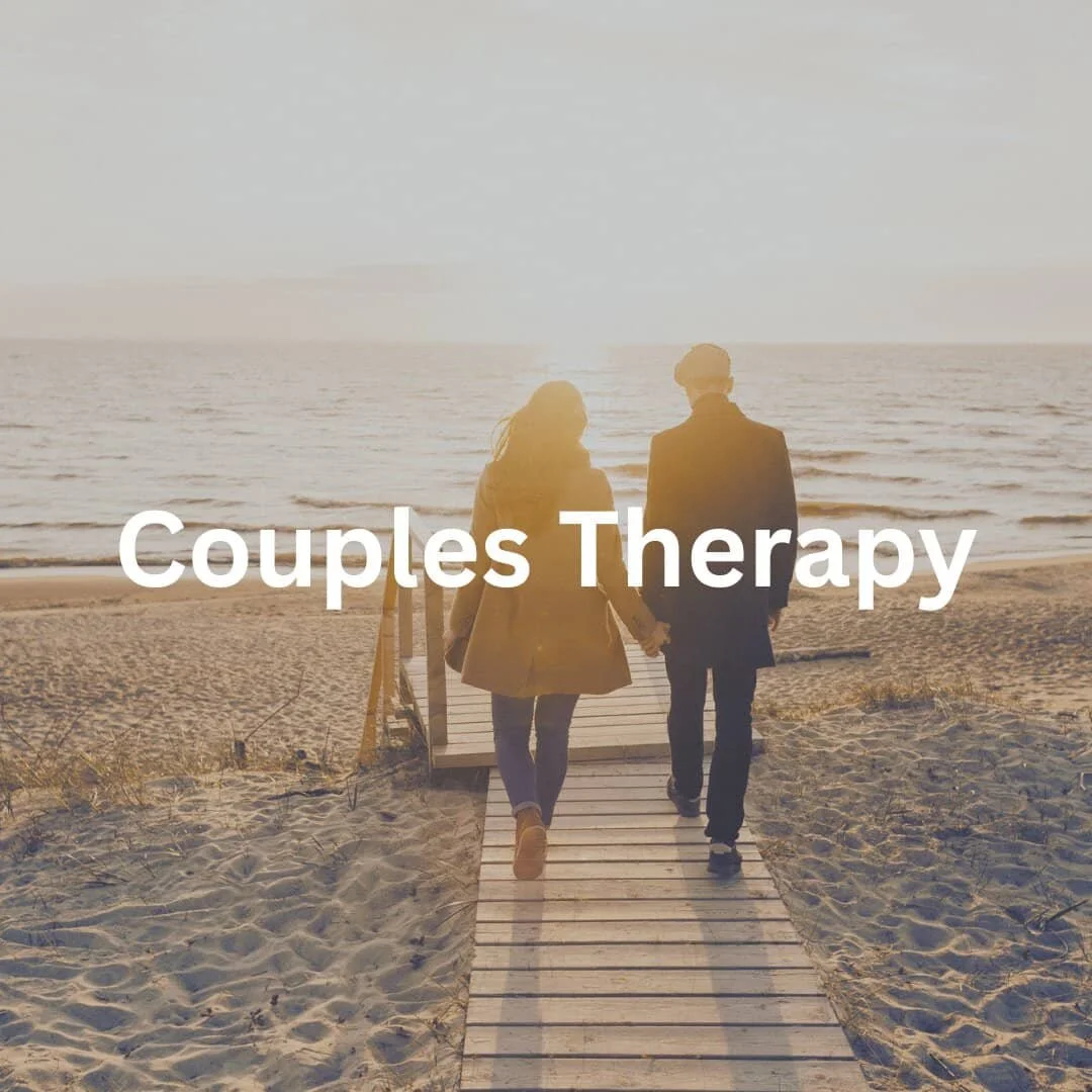 couples walking on wooden walkway towards ocean