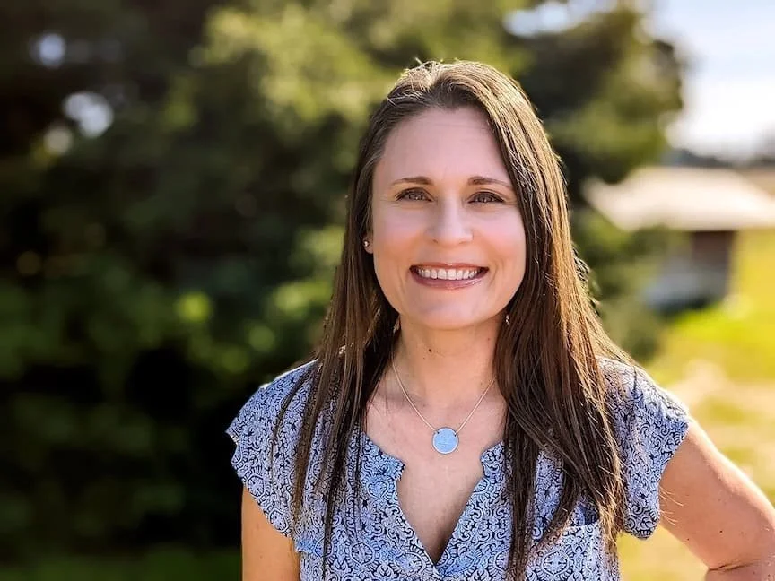 woman with dark hair smiling