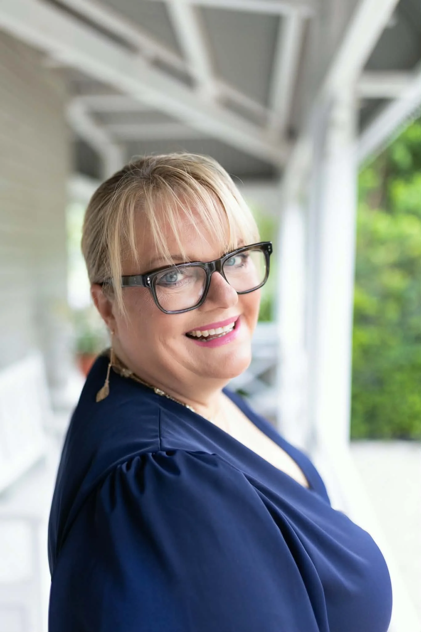 Lindy Leyonhjelm, life coach at Nurturing Vitality in Echuca, smiling on a sunny verandah