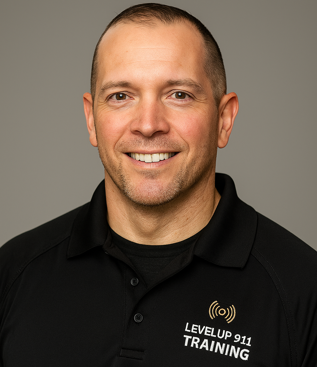 A smiling man with short hair wearing a black polo shirt with the logo and text for LevelUp 911 Training.