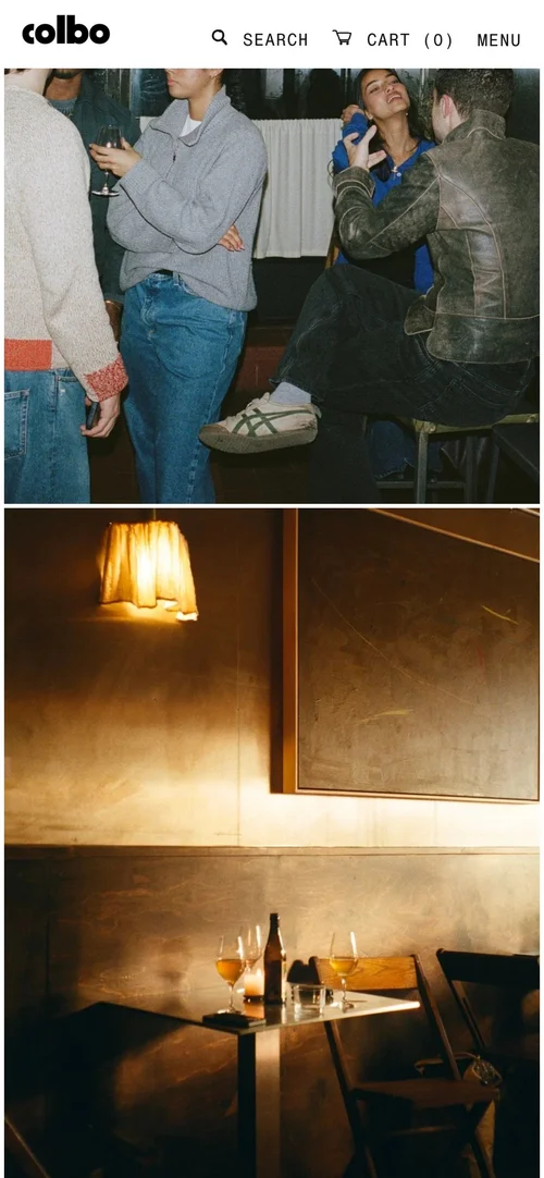 Mobile screen: Next Door photos, a lamp-lit table at the bar