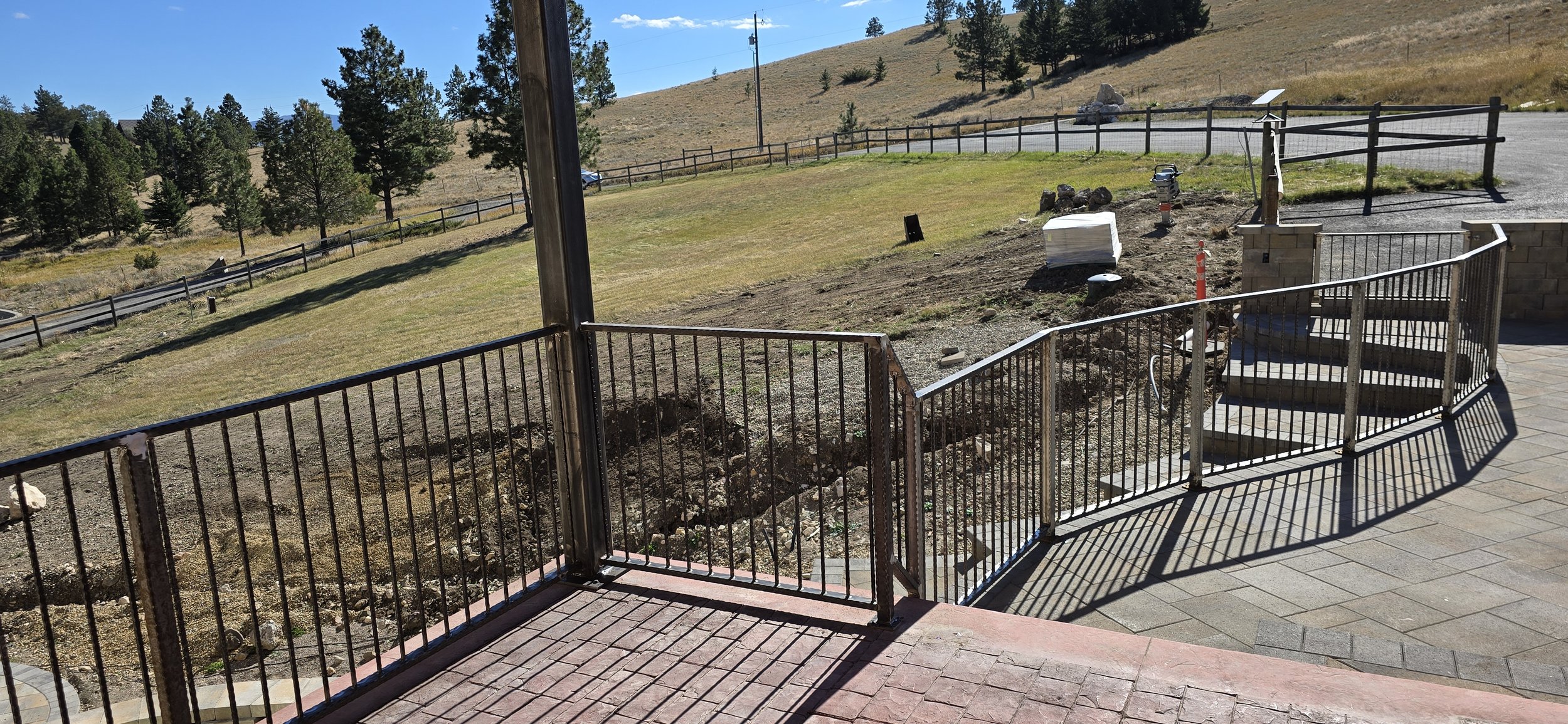 Custom hammered handrail for stone patio area built on site. 
