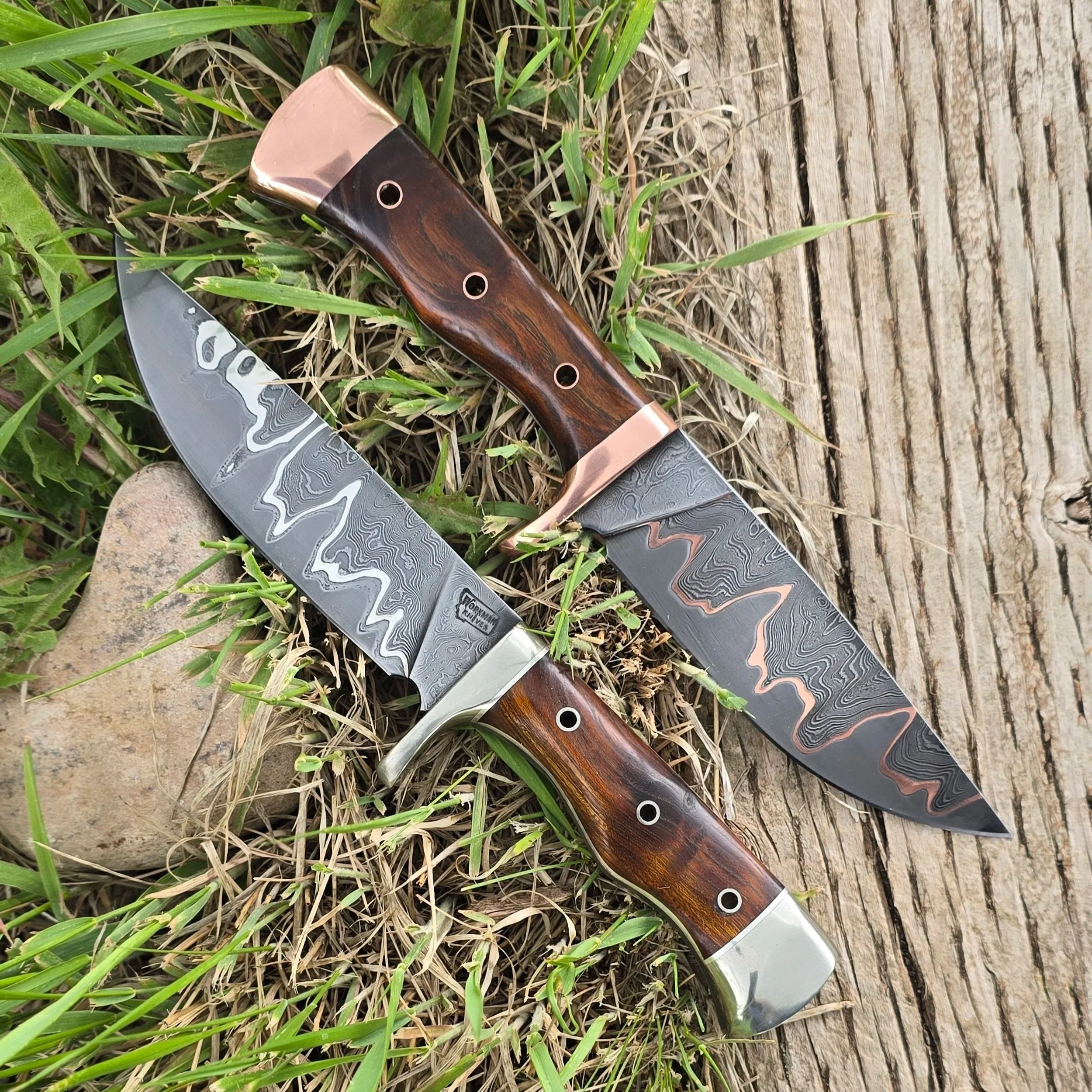 Three high carbon steel hunting knives with cocobolo wood handles.