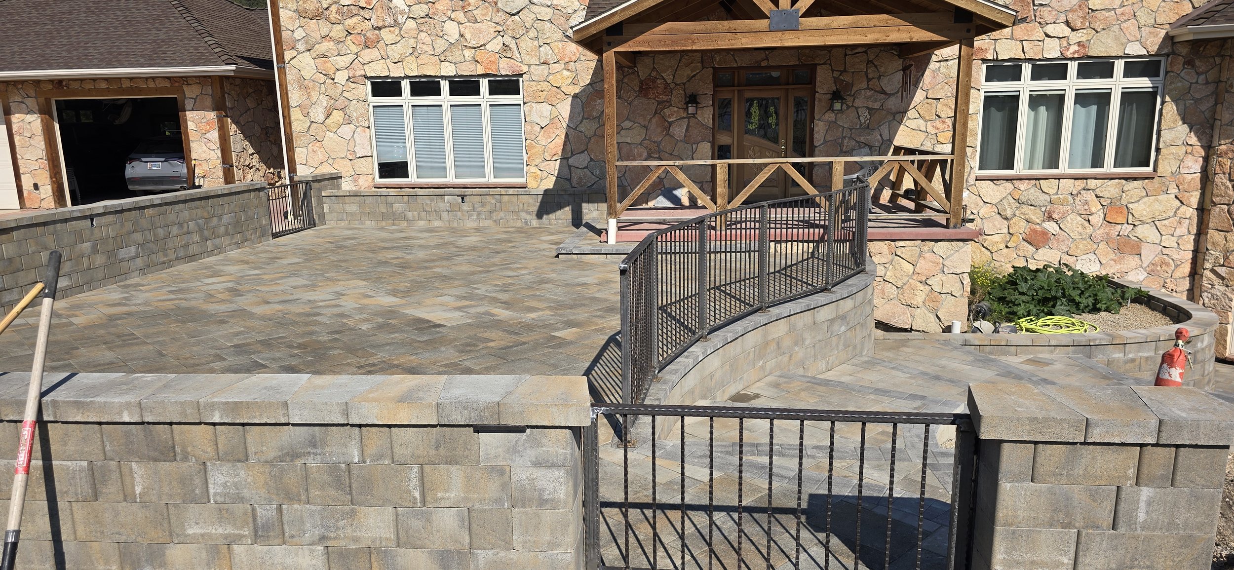 Custom hammered handrailing for front porch stone patio in Clancy Montana. 