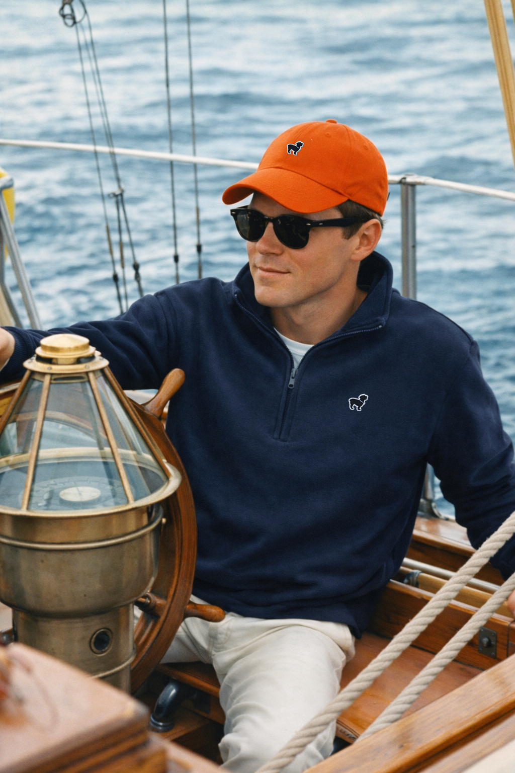 Sailing Orange Hat and half zip navy.png