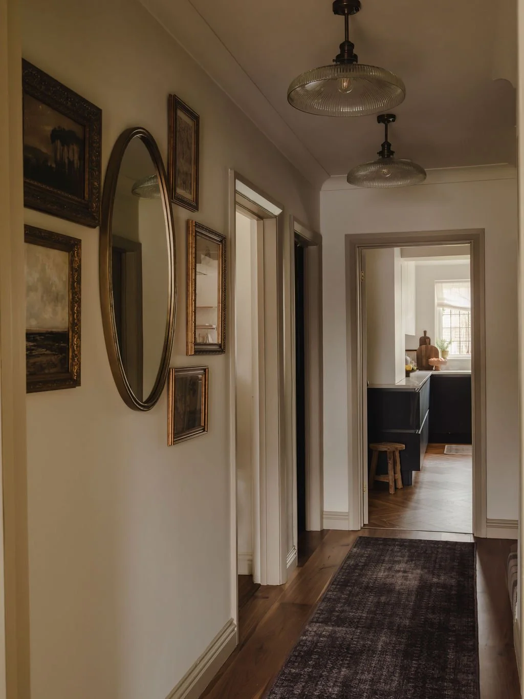 Welcoming entrance hallway with rugs and refined styling
