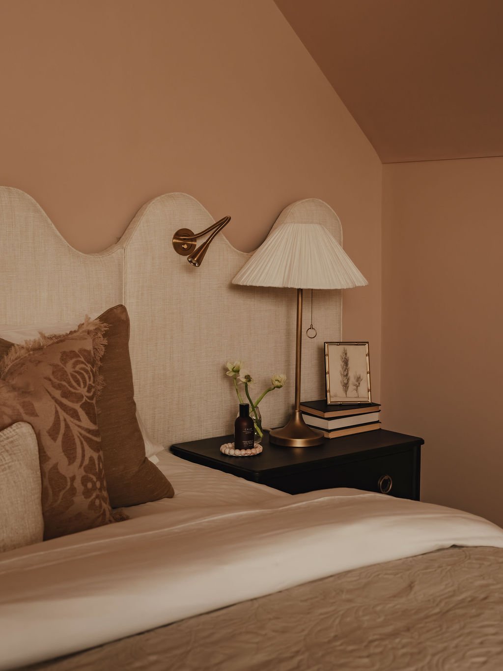 Elegant boutique-style bedroom with bespoke headboard and soft textures in Bourne End
