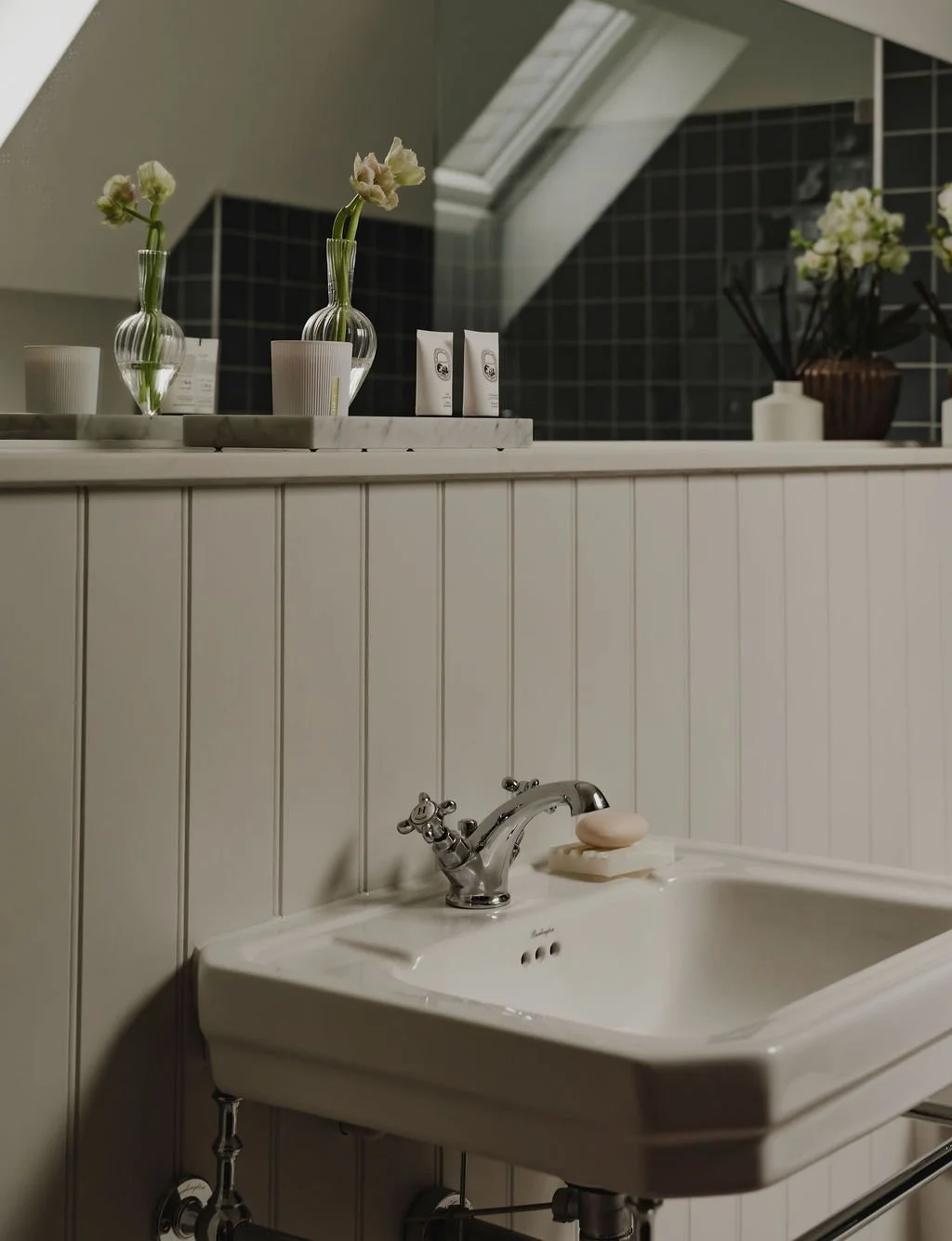 Guest bathroom styling in Bourne End focused on the basin area with considered accessories and soft finishes

