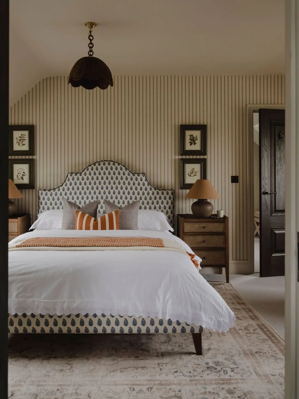 Custom upholstered bed with layered soft furnishings in a Bourne End, Buckinghamshire bedroom
