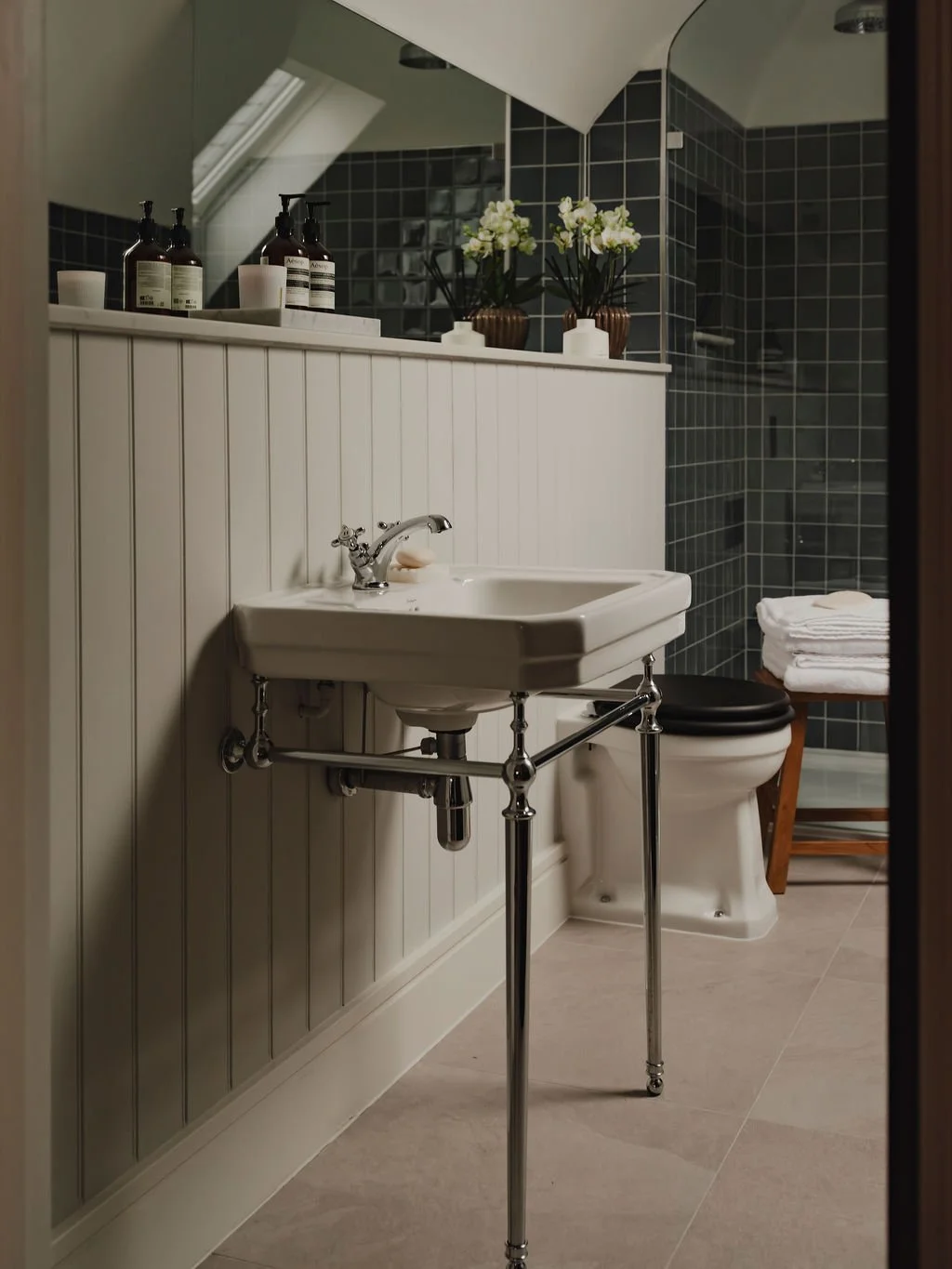 Styled guest bathroom in Bourne End, Buckinghamshire with refined accessories and calm, neutral tones
