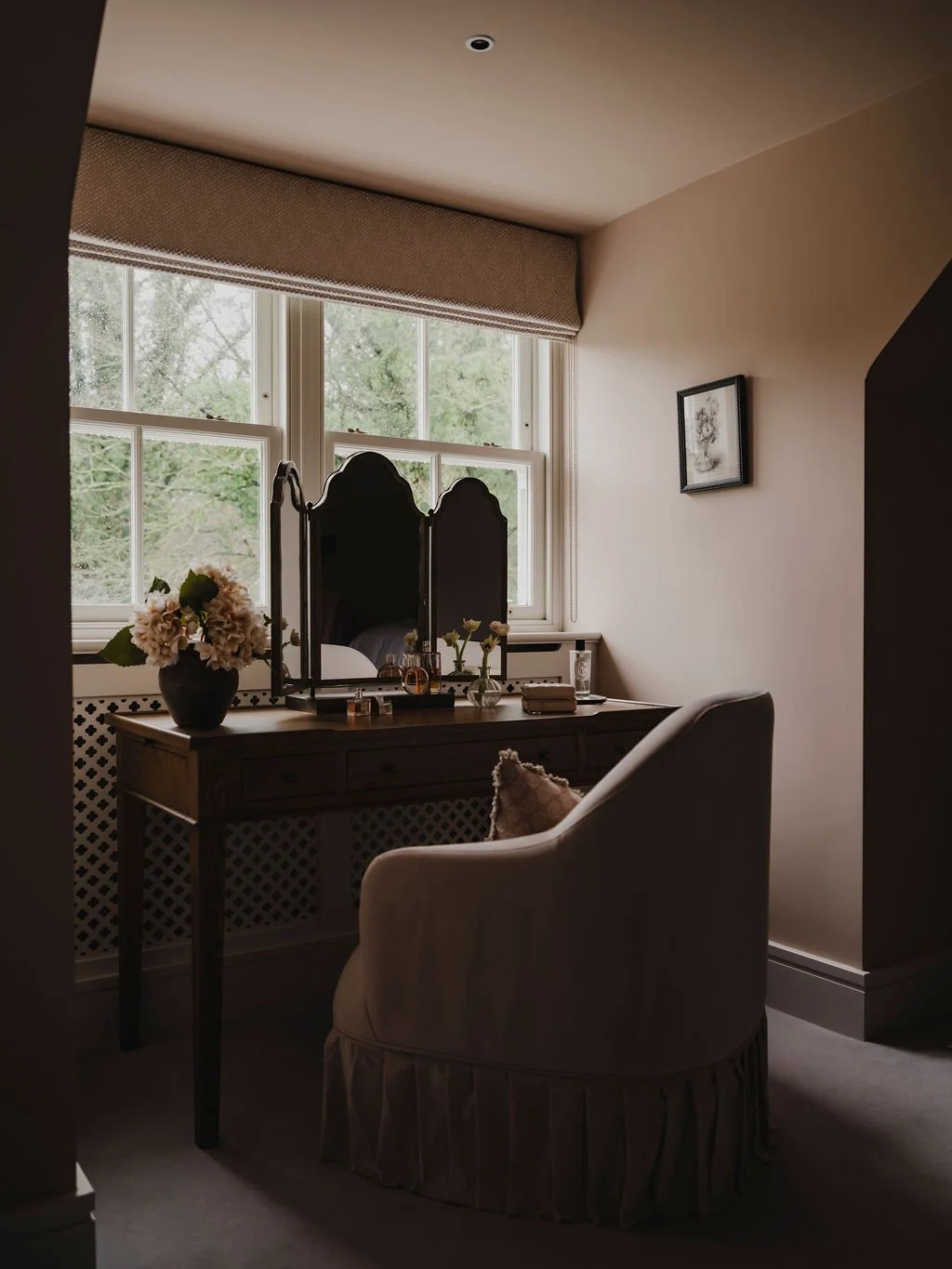 Dressing table and seating detail in a romantic Bourne End, Buckinghamshire guest bedroom design
