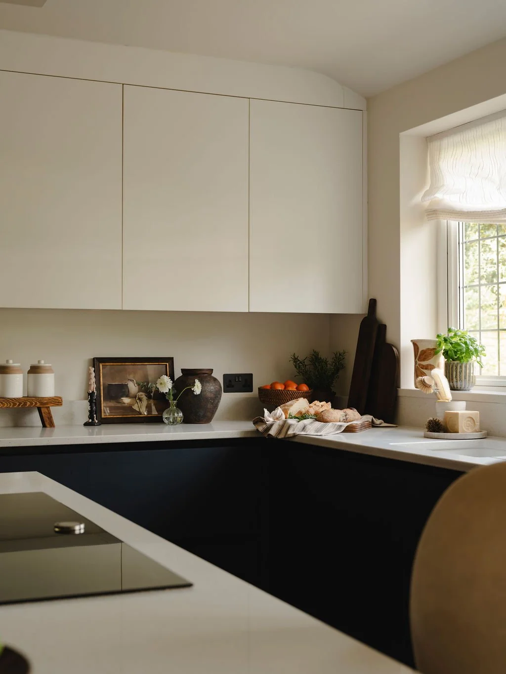 Neutral kitchen interior design with warm tones and layered styling