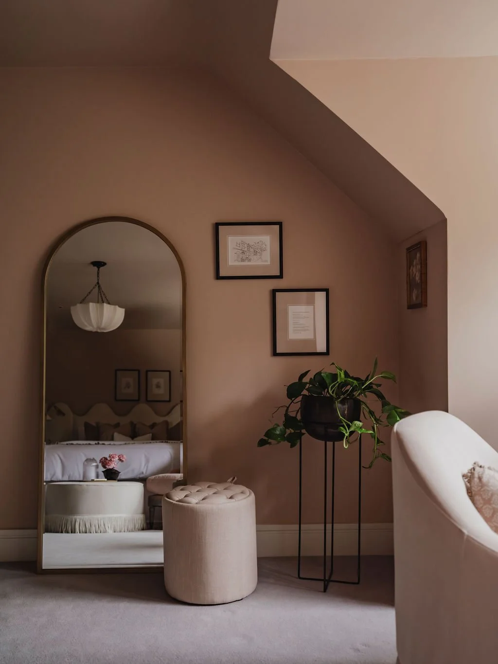 Guest bedroom corner styling with mirror in a boutique-style Bourne End interior
