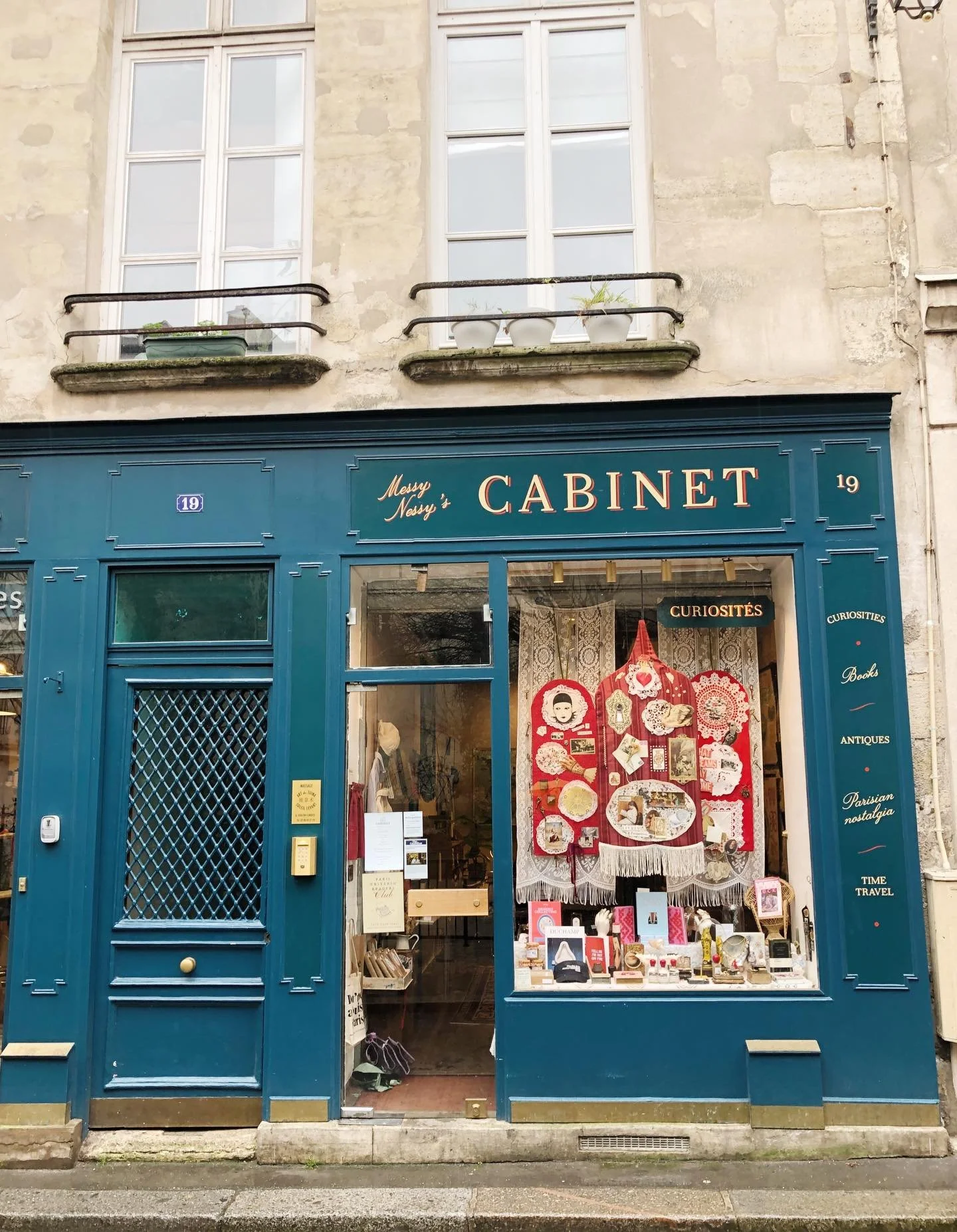 Are you looking for the perfect souvenir to bring home from your trip to Paris? Go ahead and get the Eiffel Tower key chain. But then head straight to @messynessychic in the 5th! It&rsquo;s impossible to put this cute shop with the blue door into jus