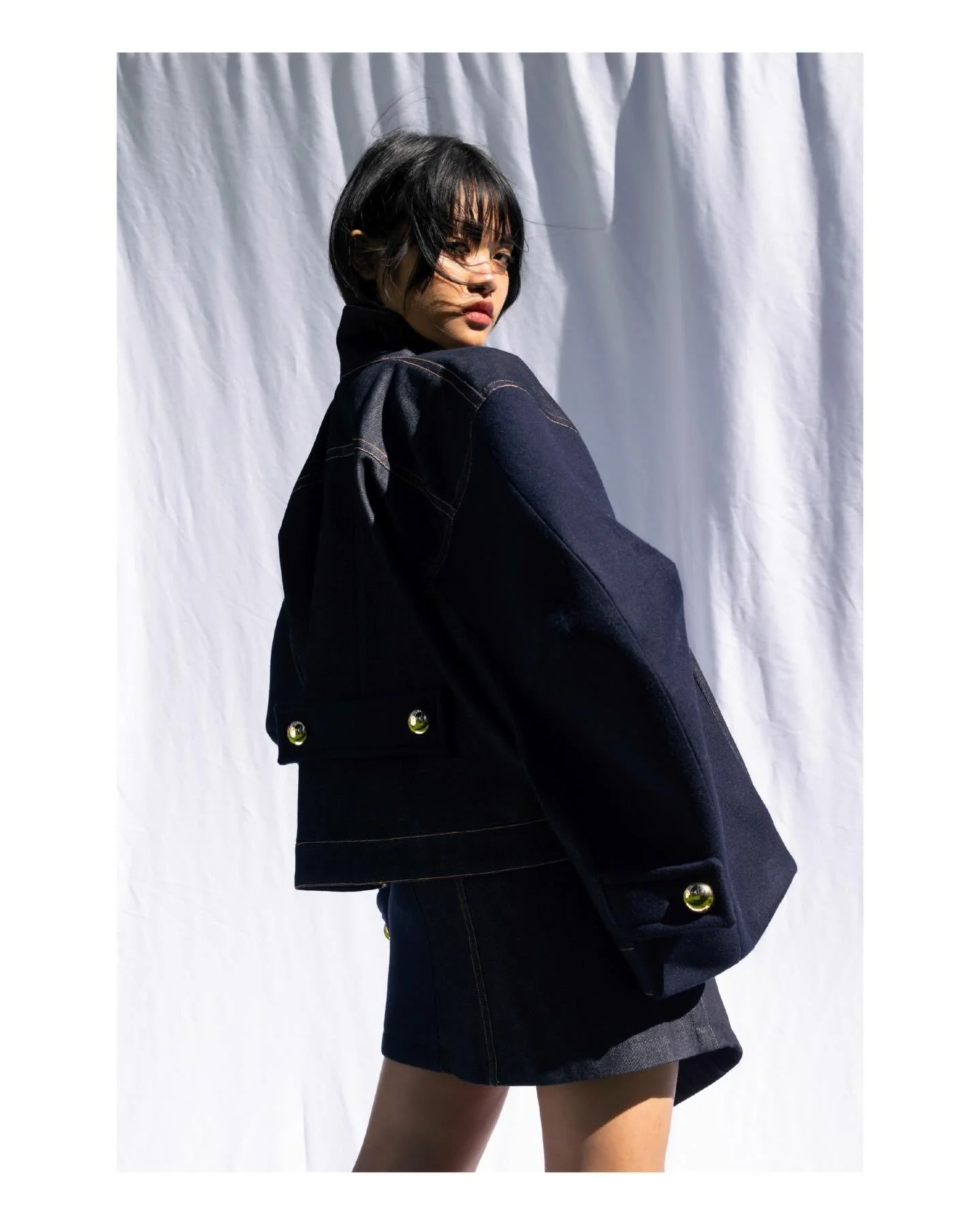 A study in contrast &mdash; a sculpted silhouette set against a world that dissolves into light and air.
Silent armor spreads through the body, gaze unchanged, affront the veiled realm named reality. 

Light a flame, pray the light exposes answers to