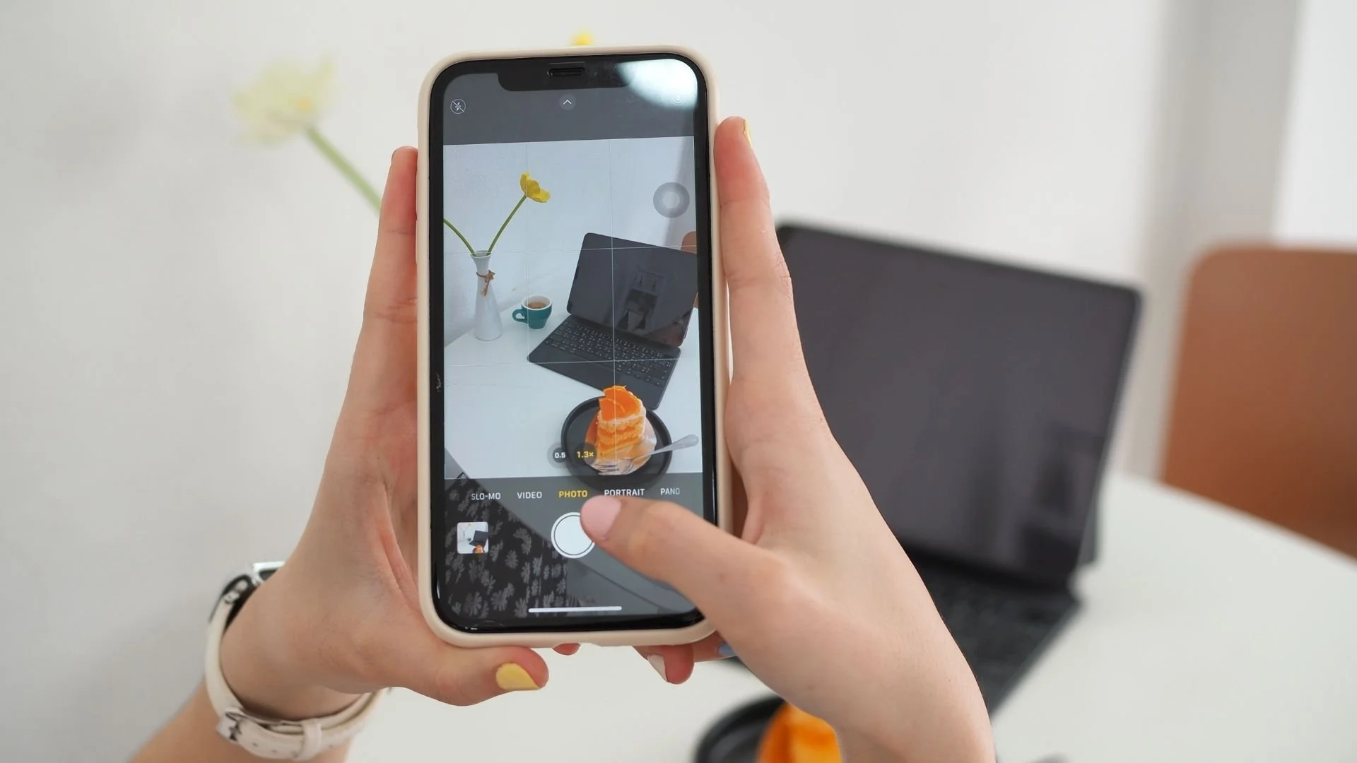 A person is taking a creative smartphone photo with a cell phone