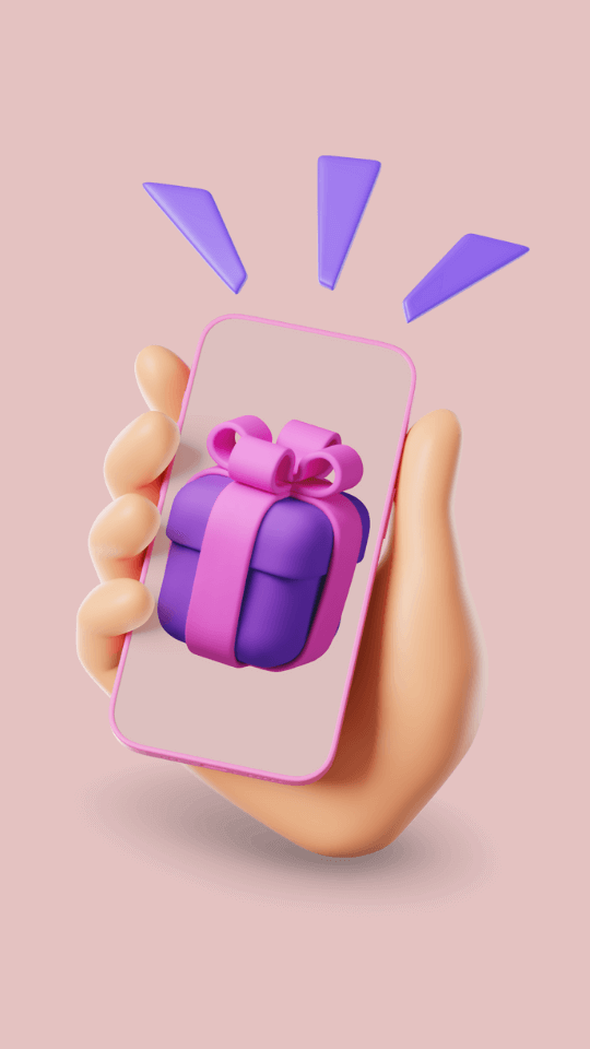 A hand holding a smartphone with a pink case displaying a purple gift box wrapped with a pink ribbon and bow, against a pink background with blue exclamation marks.