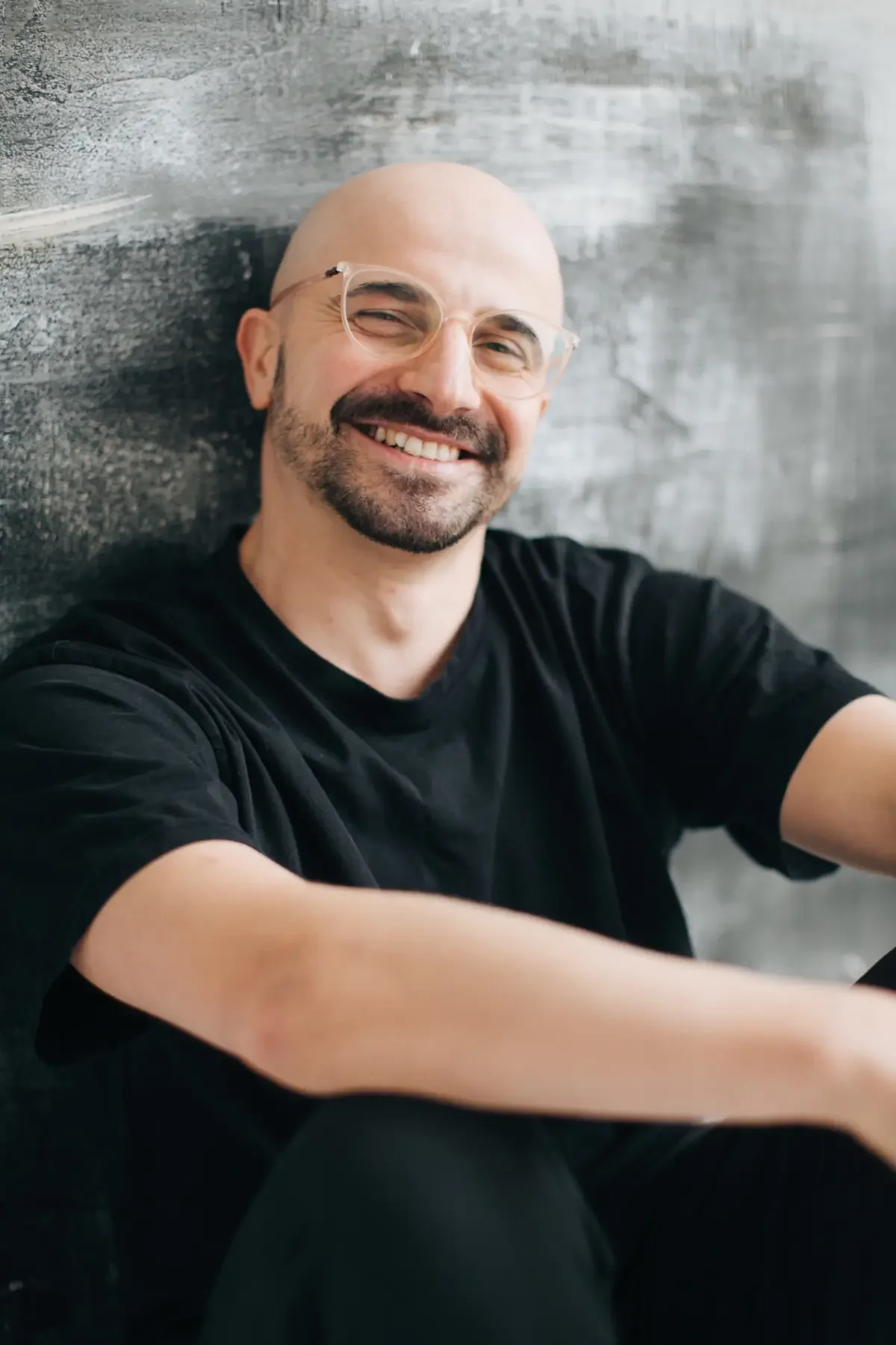 Inviting portrait of host Danylo Torbovskyi with a smile
