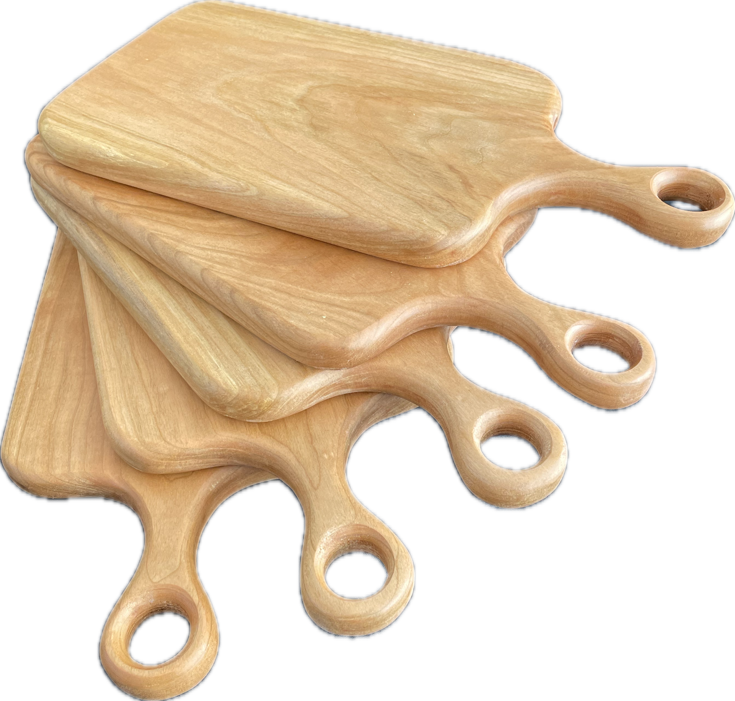 Wooden cutting boards with a rounded handle with a circular hole.