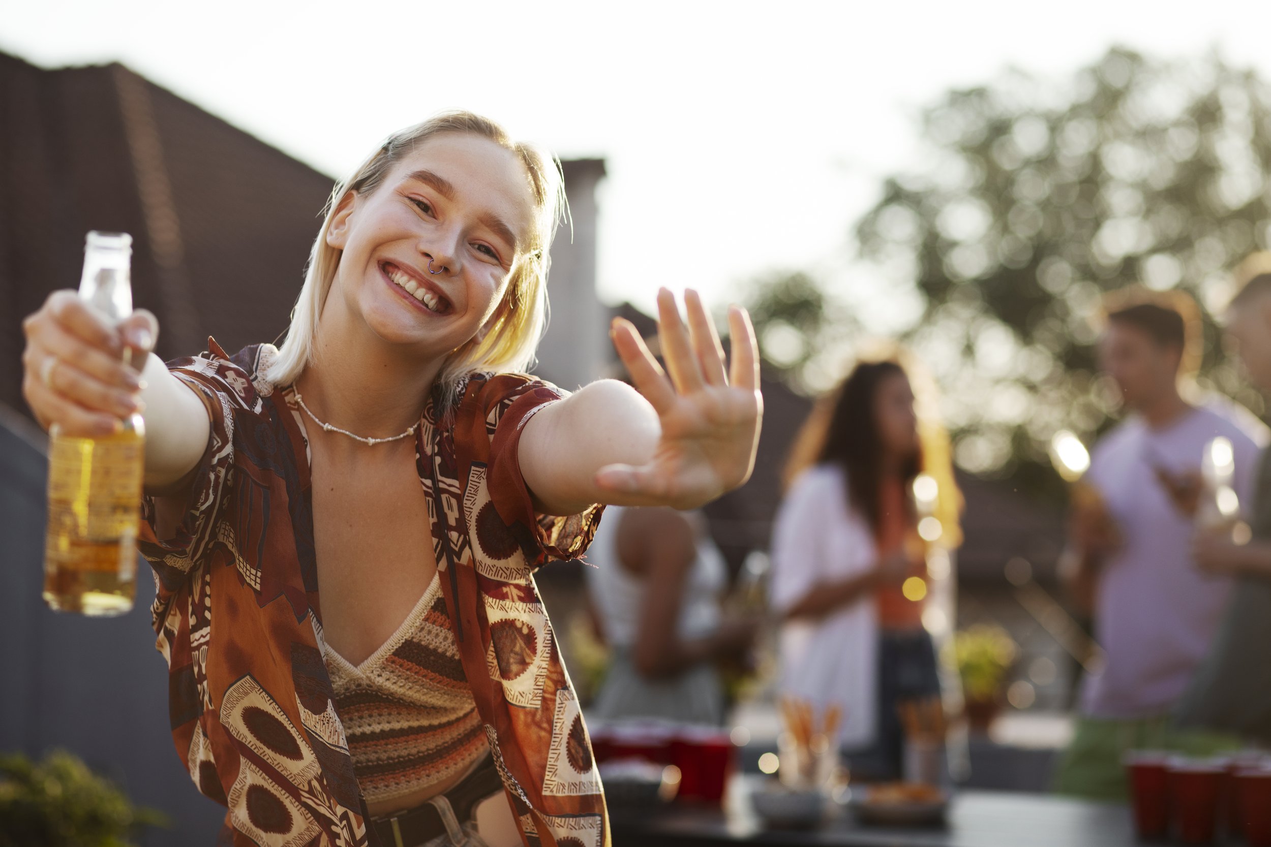 front-view-smiley-woman-holding-drink.jpg