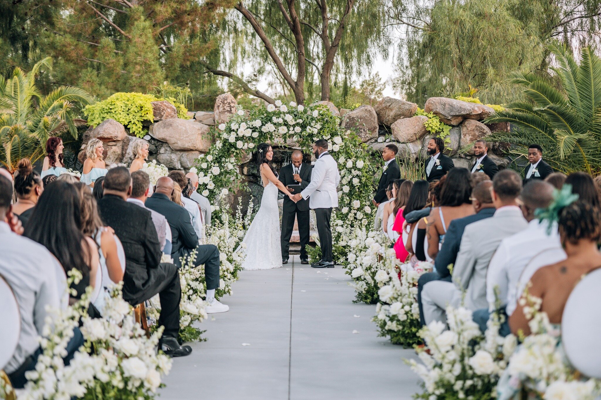 The joy after saying &quot;I DO&quot; 💍

Our waterfall backdrop with the combination of @saralunnfloral 's stunning lush arch, is a match made in heaven. The perfect frame for beautiful ceremony photography 📸

Venue: @lotushouseevents 
Coordination