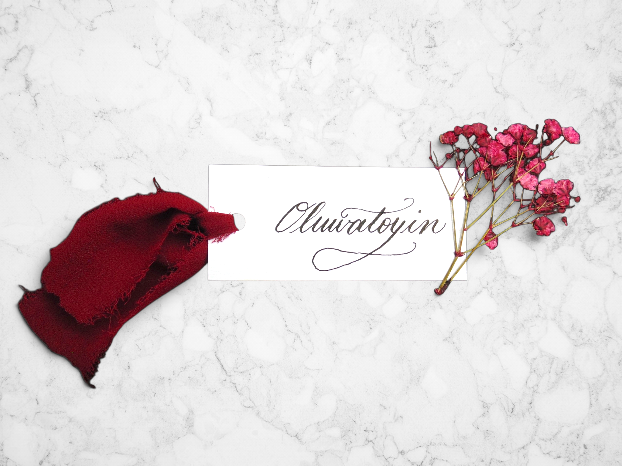 Sher-Pierre-NJ-NY-NYC-Calligrapher-and-Engraver-Engraved-Wine-Glass-Place-Cards-With-Ribbons-Nigerian-Name.png
