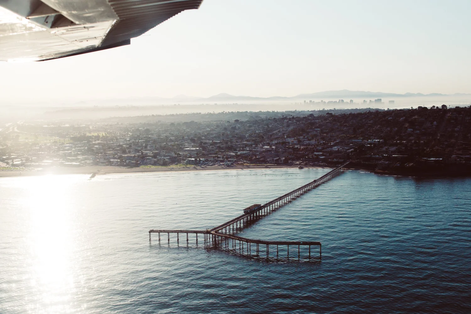 The Ocean Beach Pier and the San Diego coastline seen from a plane
