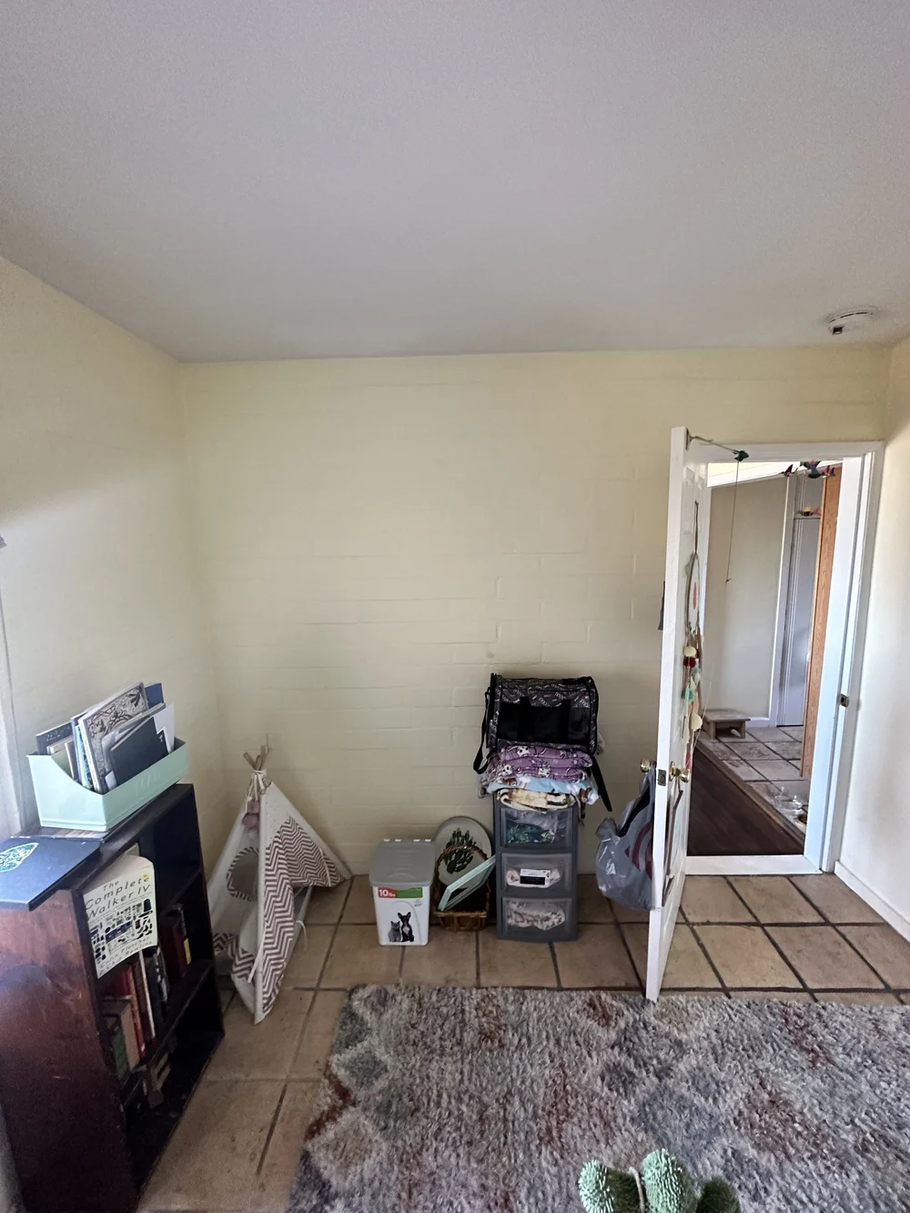 Before: Living room with a tile floor at Clementine B in Oceanside