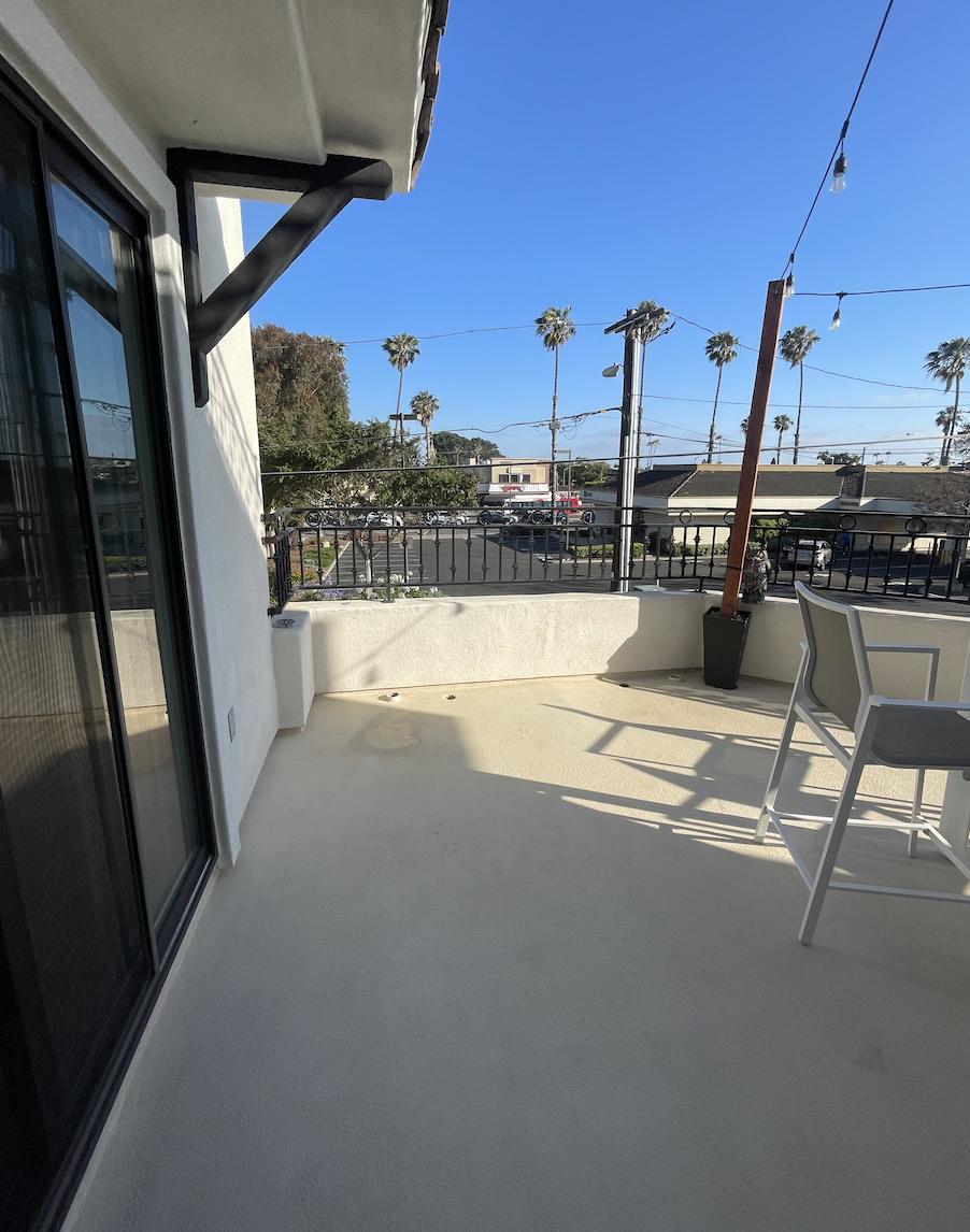 Before: Empty balcony with one patio chair at Coastal Palm in Pacific Beach