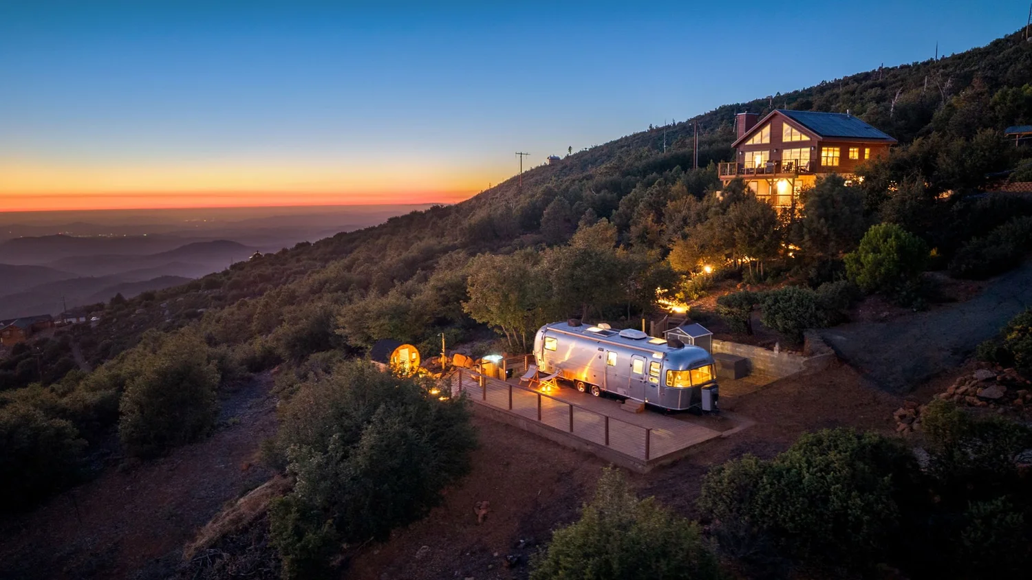Restore Outpost Airstream and wellness deck at sunset, a cabin rental with sauna near San Diego