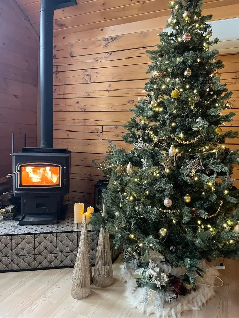 Guest photo: the Christmas tree beside the wood-burning stove