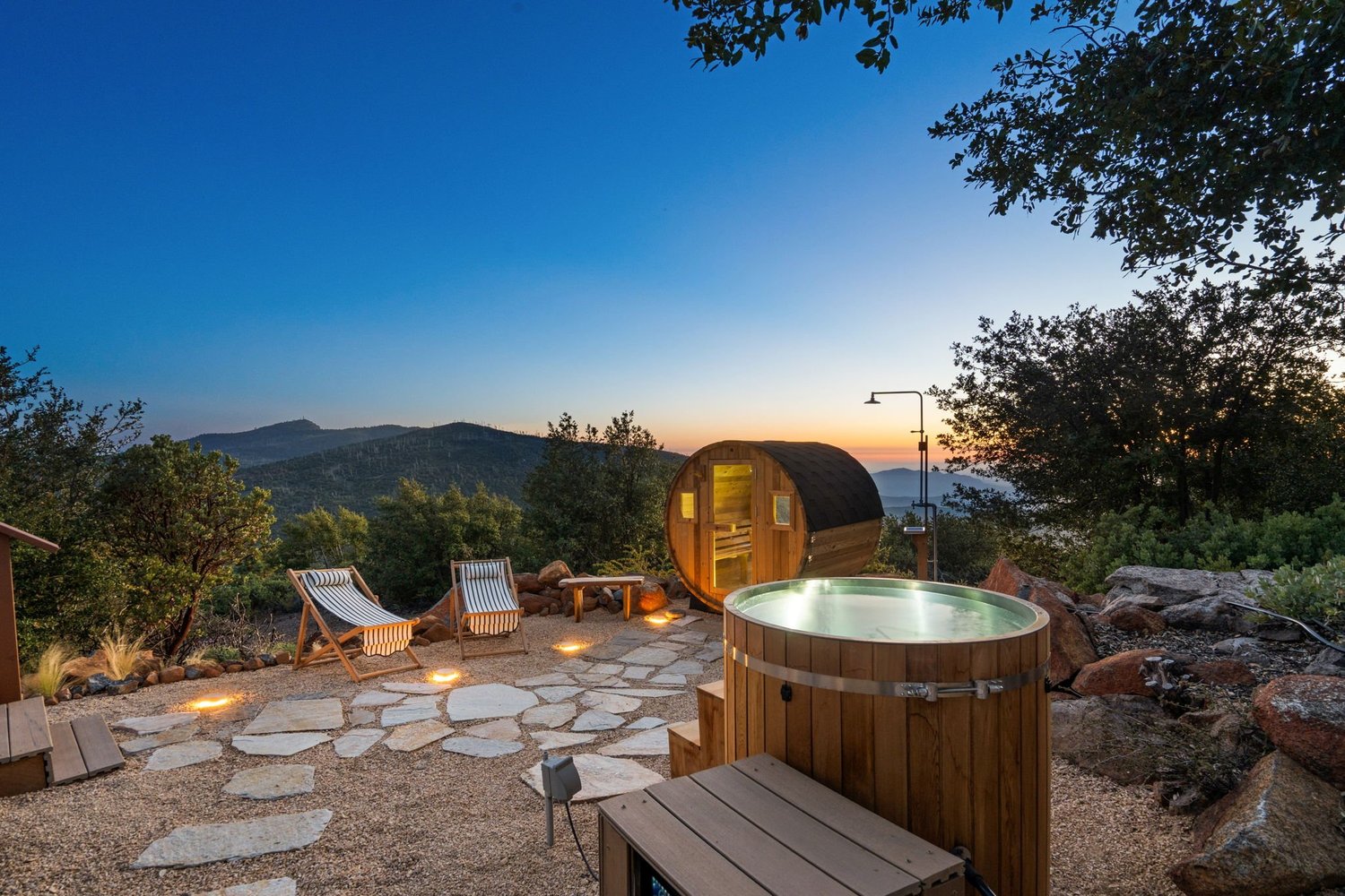 Barrel cold plunge beside the sauna for contrast therapy at a Julian retreat venue