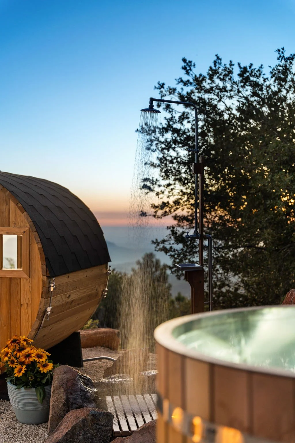Outdoor shower beside the sauna and cold plunge at Wild Moon Ranch