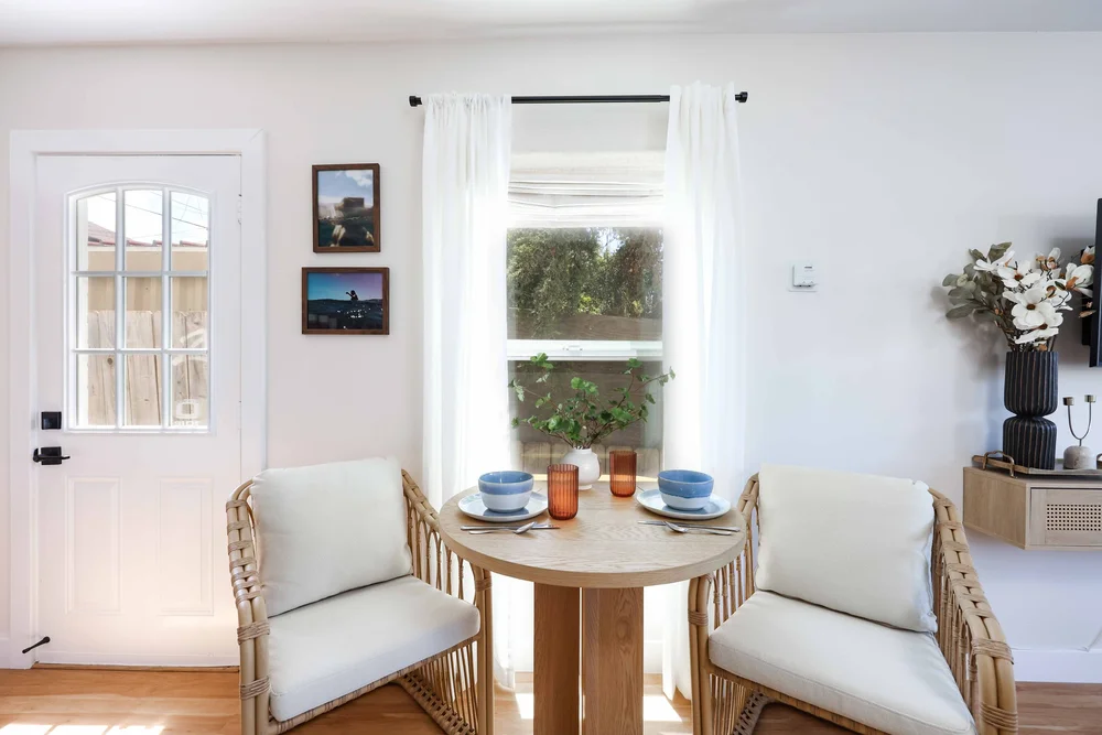 The bistro dining table by the window in Unit Two at The Swell, Oceanside