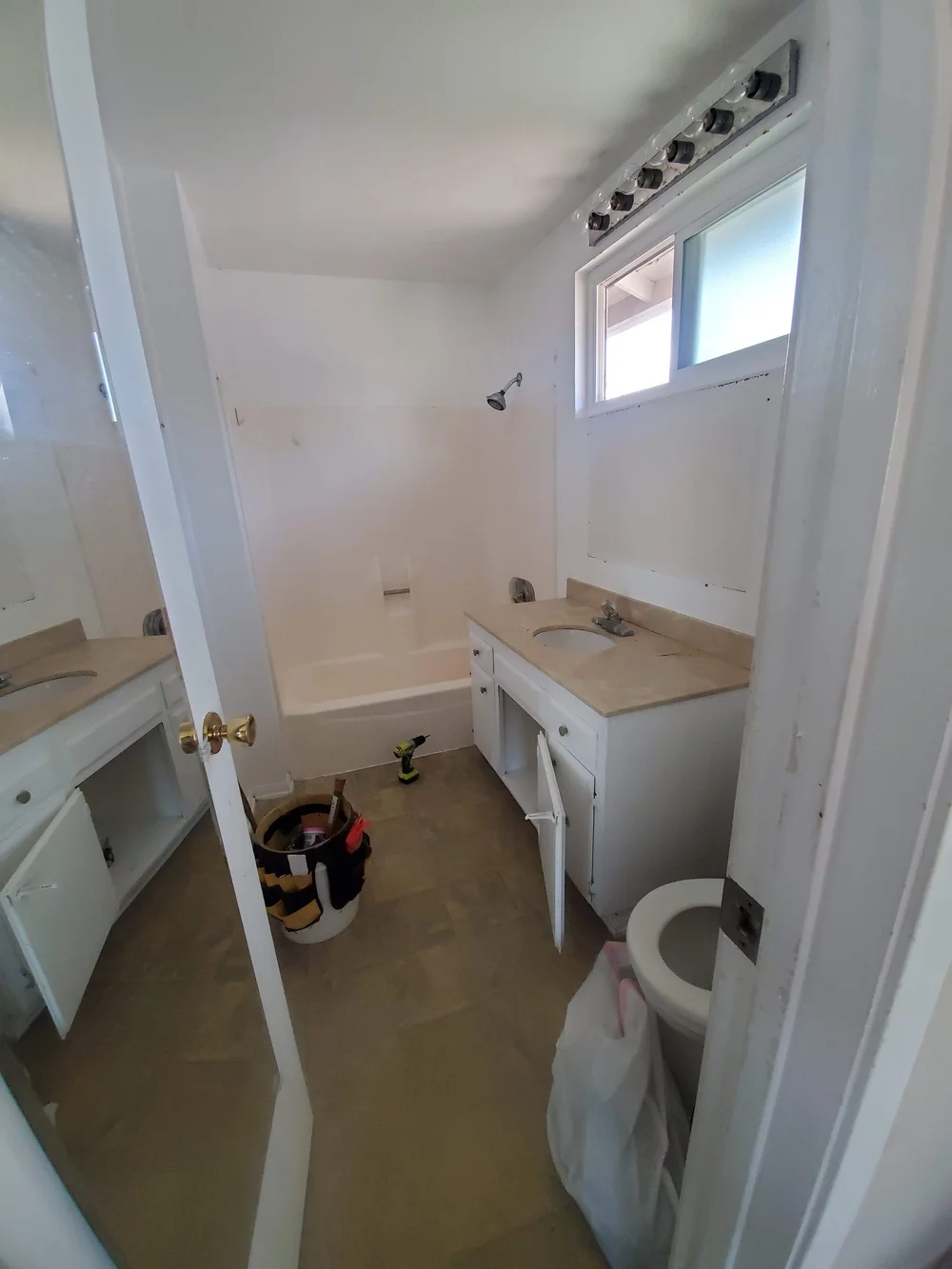 Before: Bathroom with an old vanity at OB Surfer's Paradise in Ocean Beach