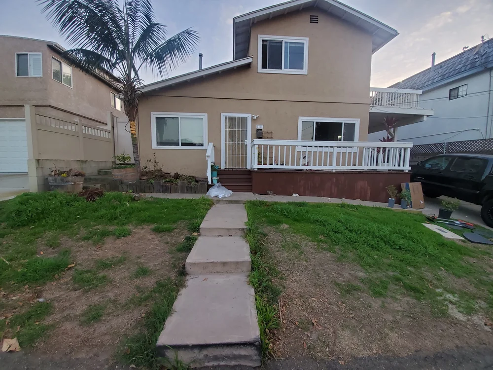 Before: Backyard lawn with stepping stones at OB Surfer's Paradise in Ocean Beach