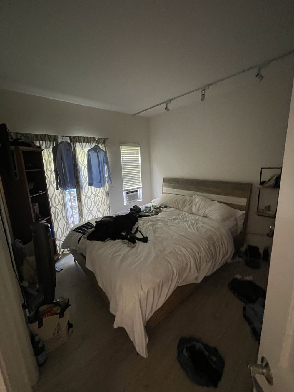 Before: Bedroom with a wood floor at Velvet Surf in Pacific Beach